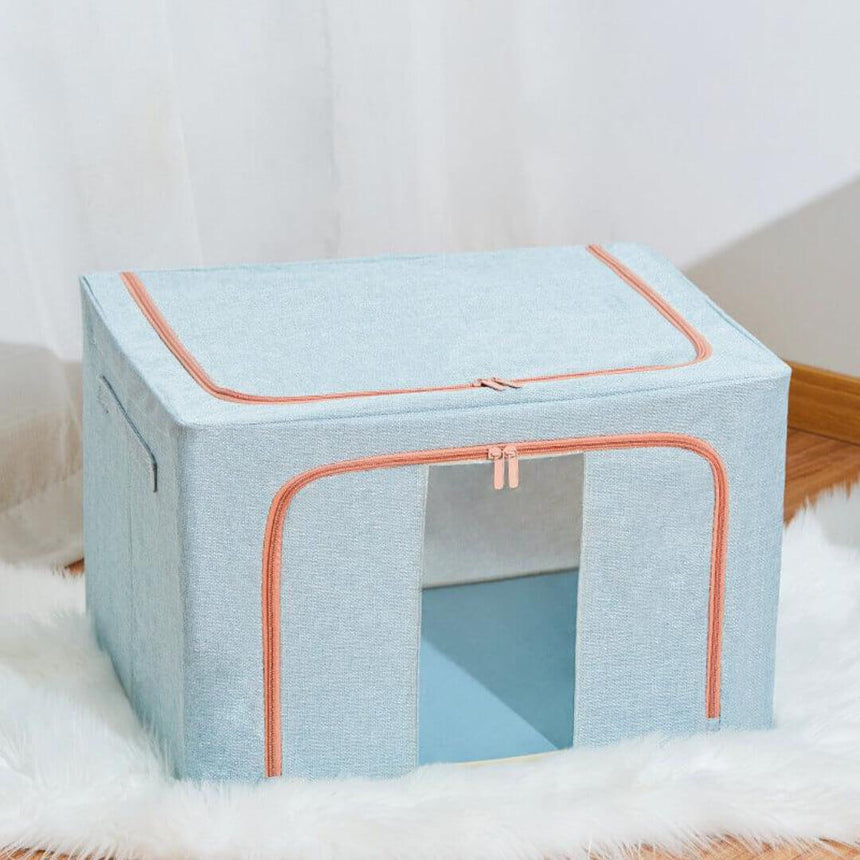 Foldable closet storage bin in blue for blankets and sweaters