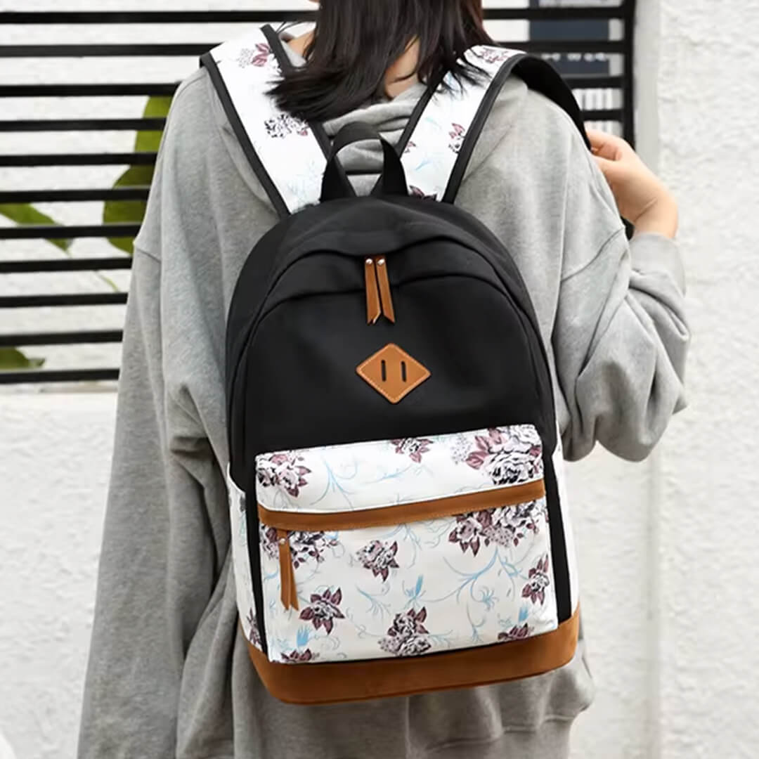 Black school backpack with white vintage brown floral front pocket