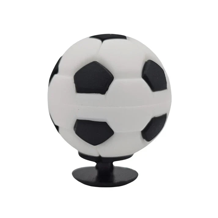 Soccer ball-shaped phone stand on a white background