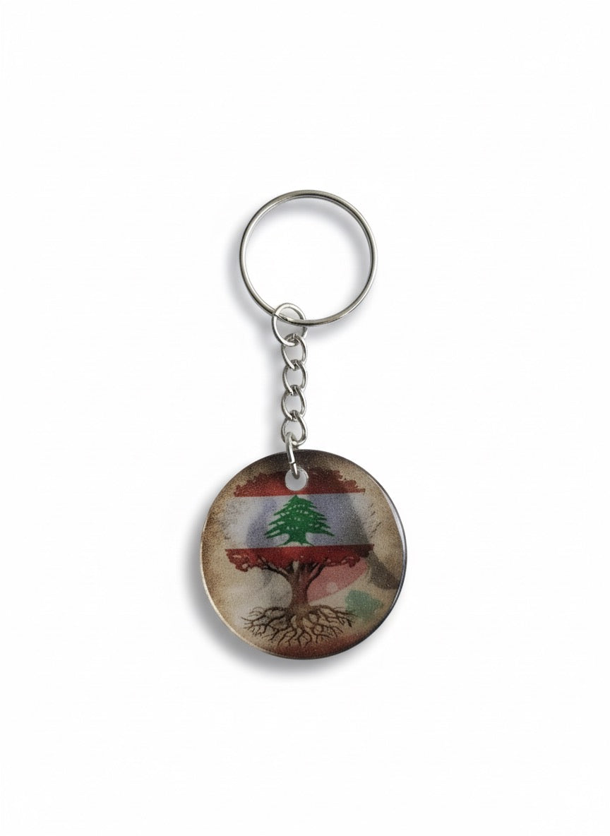 Keychain with Lebanon tree design on a white background