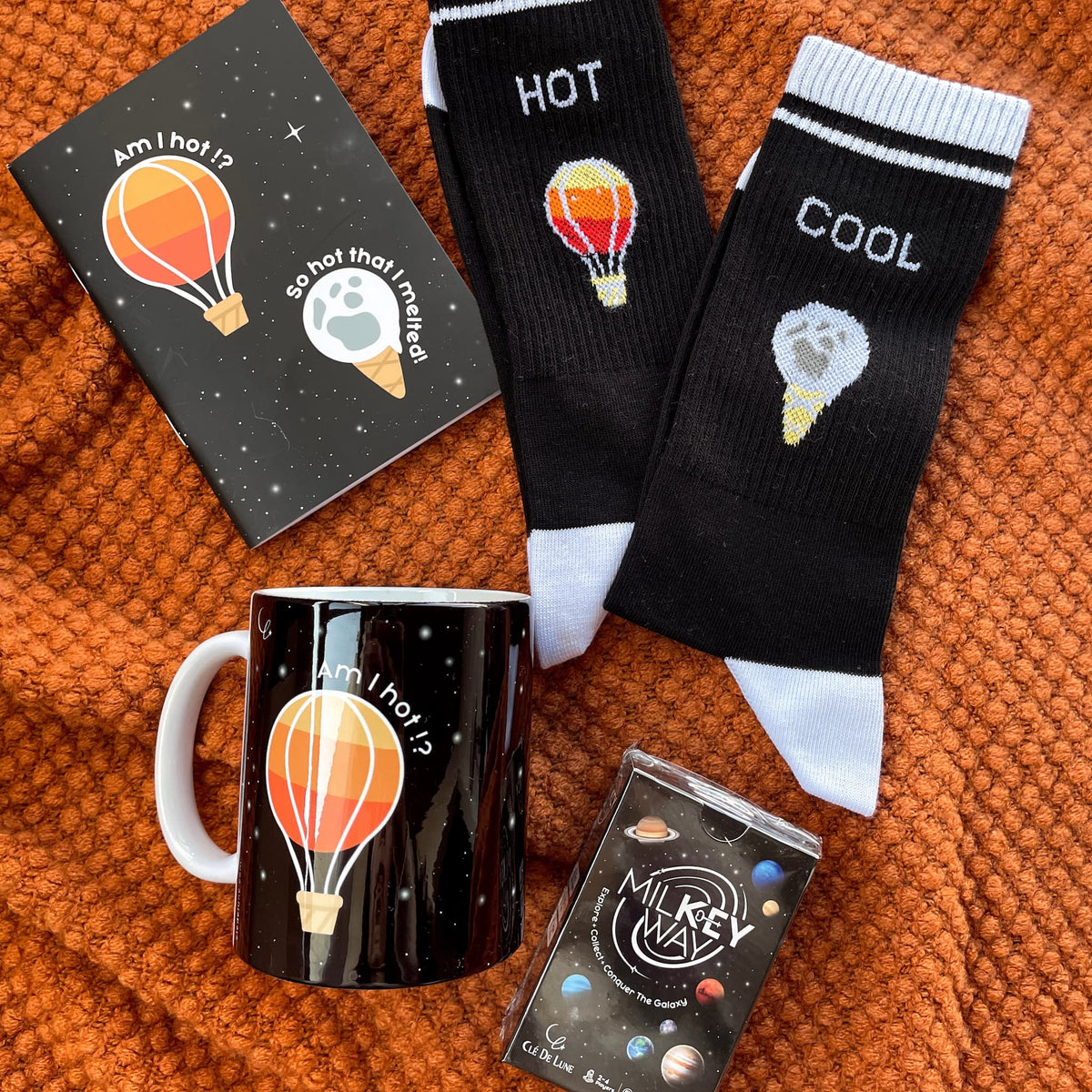 Sun & Moon Set - 1 Game, 1 Pair of Socks (Women Size), 1 Mug, 1 Notebook