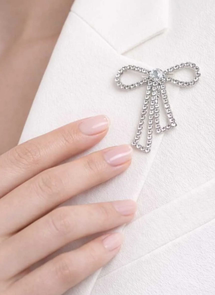 Silver Dangling Bow Ribbon Brooch With Zircon Stones