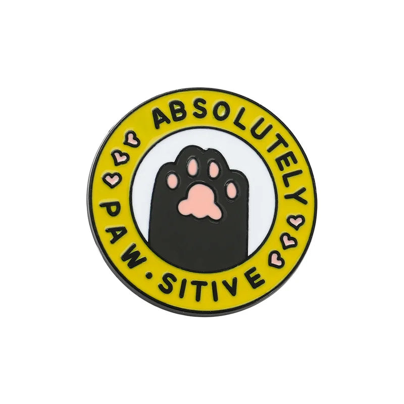 Circular badge with a paw print and 'Absolutely Paw-Sitive' text on a white background