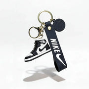 Keychain with Nike logo and shoe design on a white background
