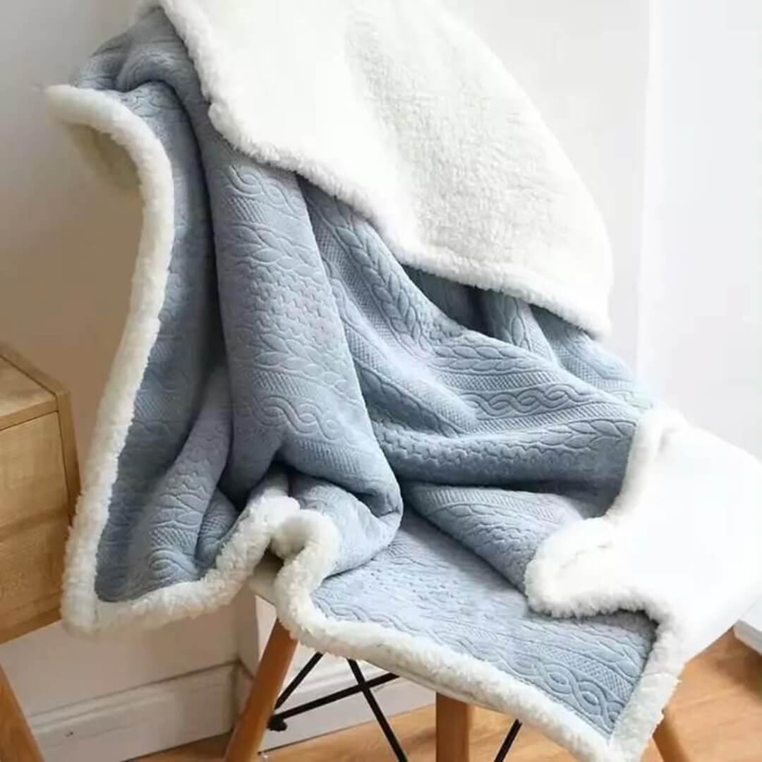 Blue flannel blanket scarf buttoned as a shawl for warmth