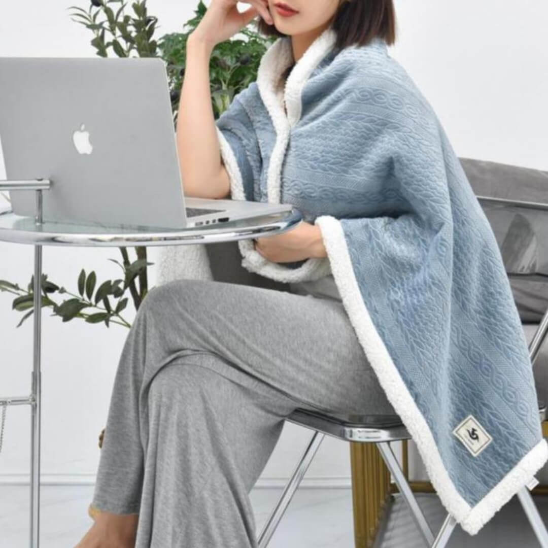 Cozy wearable blanket scarf used as a shawl while working