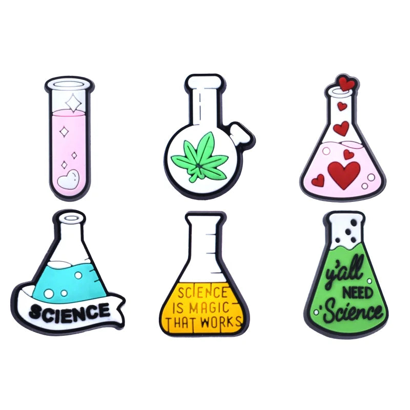A collection of six Chemistry-themed Jibbitz charms for Crocs, featuring various chemical symbols and elements such as a beaker, an atom, and a periodic table.