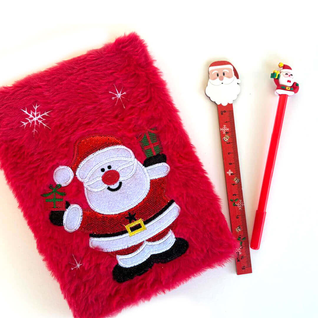 Red fluffy notebook with Santa Claus design, ruler, and pen 
