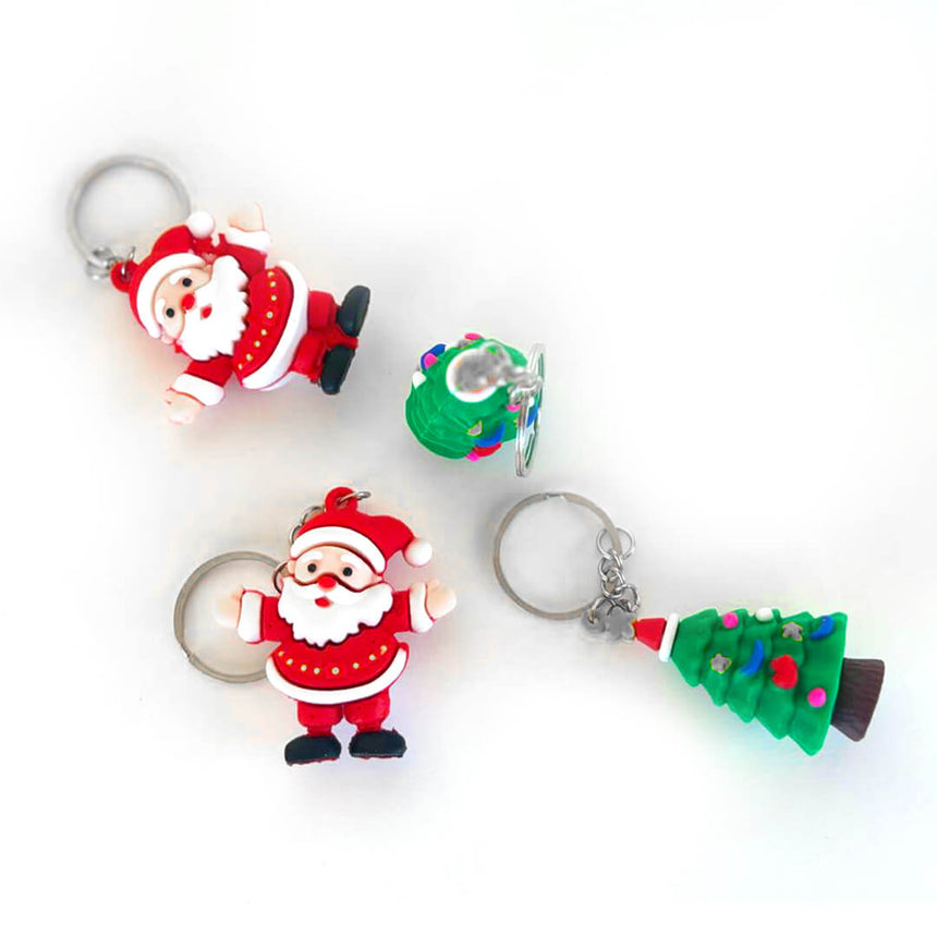Holiday-themed keychains, Santa and tree designs, top angle