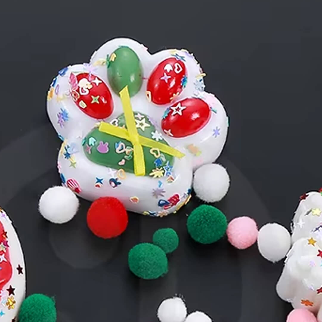 Festive paw-shaped squishy toy with glitter texture for sensory play