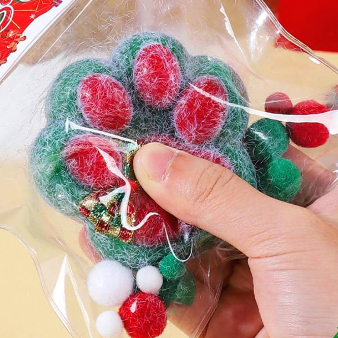 Festive paw-shaped squishy toy with fur texture for sensory play