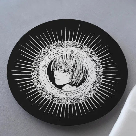 A black MDF coaster with a detailed illustration of Light Yagami from the anime Death Note.