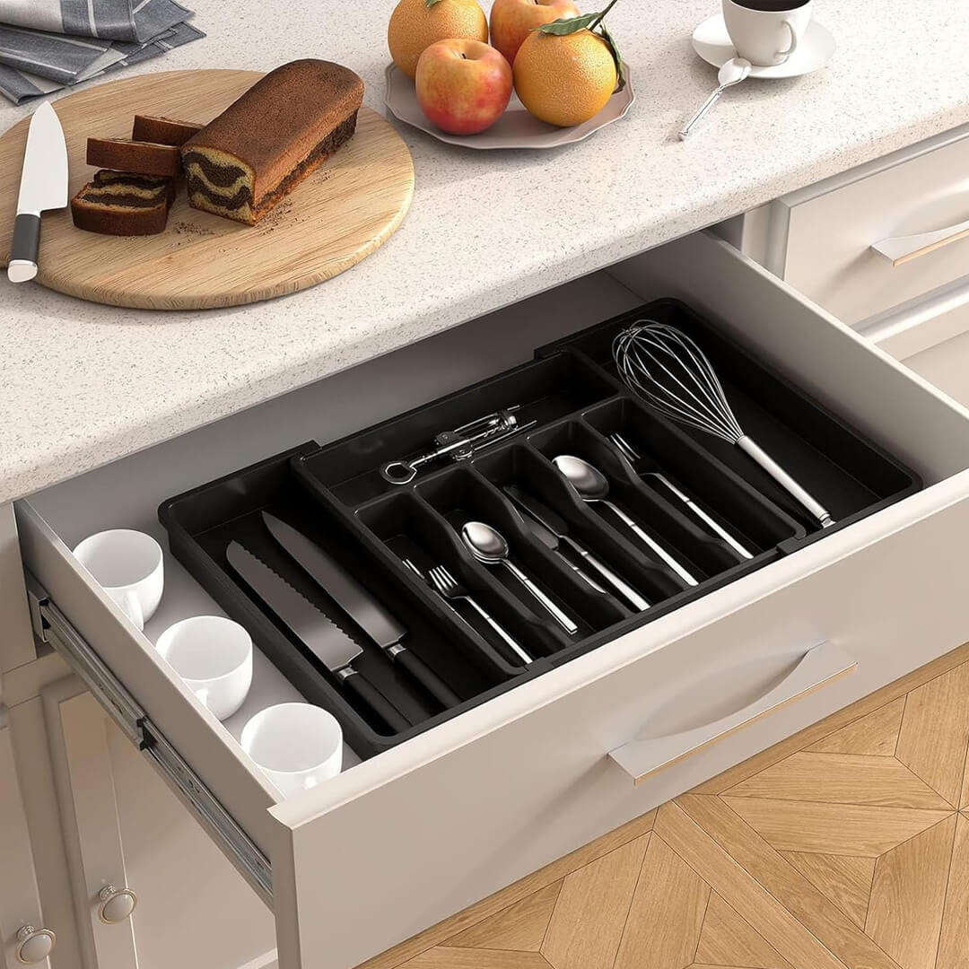 Kitchen drawer organizer expanded to fit wide drawer sizes