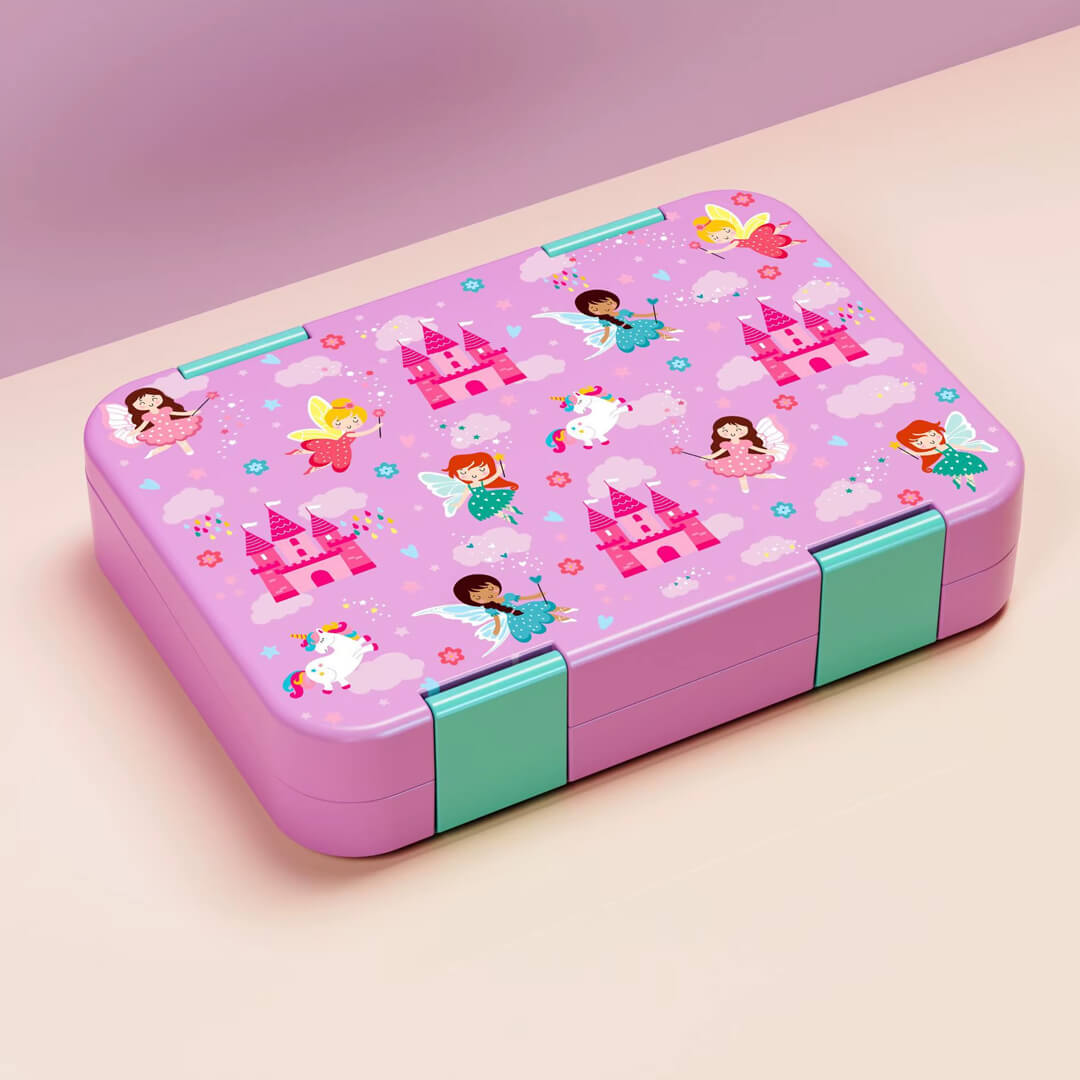A pink rectangular lunch box with fairy and castle illustrations