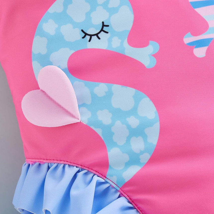 Pink seahorse swimsuit for girls comfortable fit, close-up shot