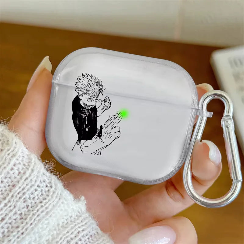 Clear air pod case with a character design held by a person wearing a white sweater.