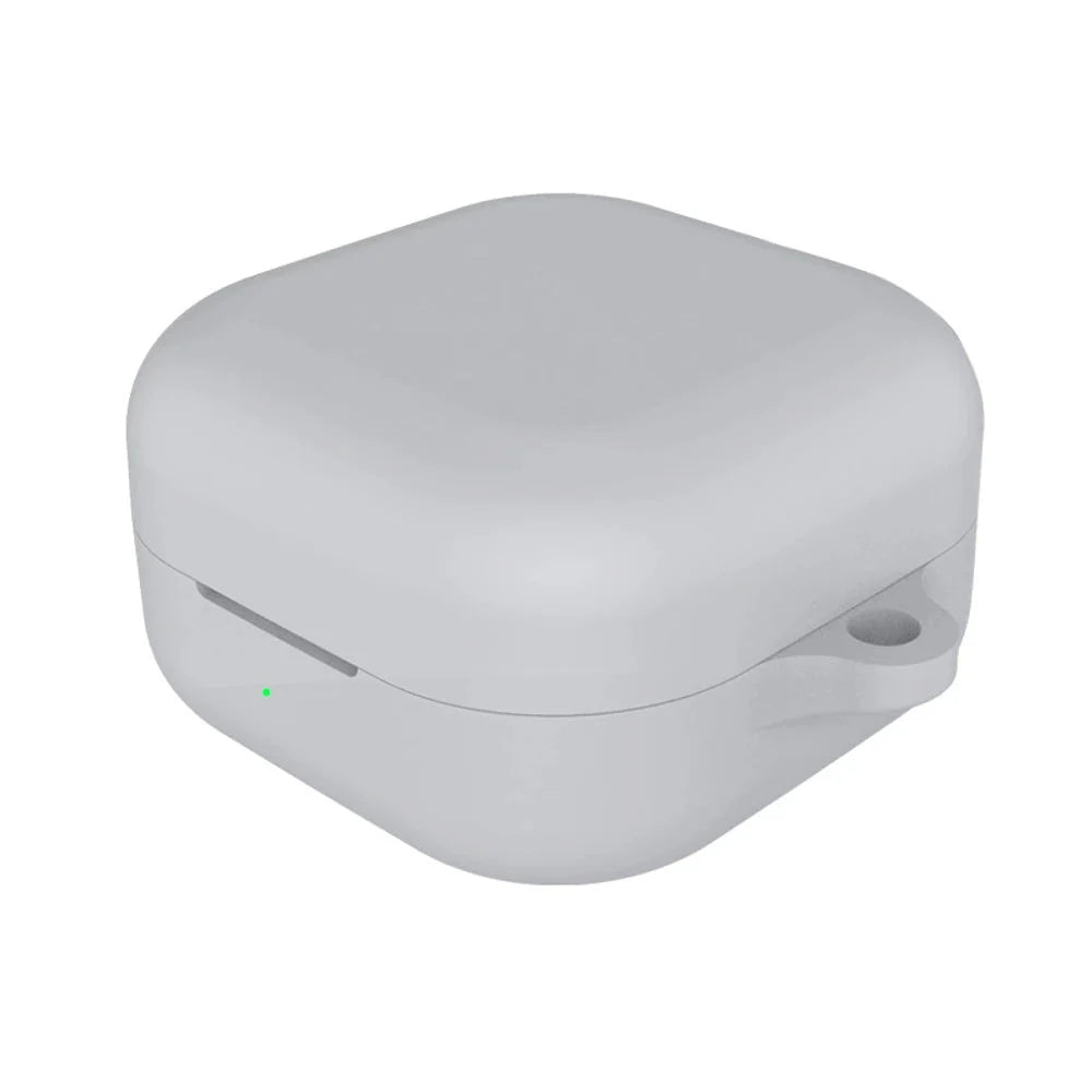 White wireless earbuds case with a green indicator light on a white background