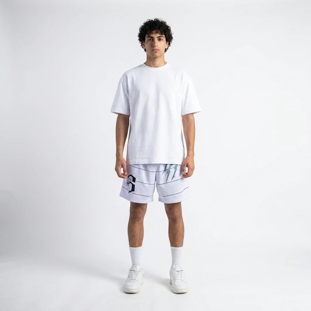 Person wearing a white t-shirt and shorts on a plain background