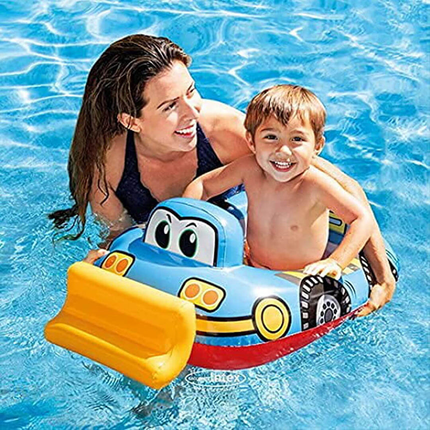 Boy wearing Intex float with tractor shape