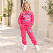 Girls hot pink Six Seven 67 sweatshirt and matching joggers, full-length standing view