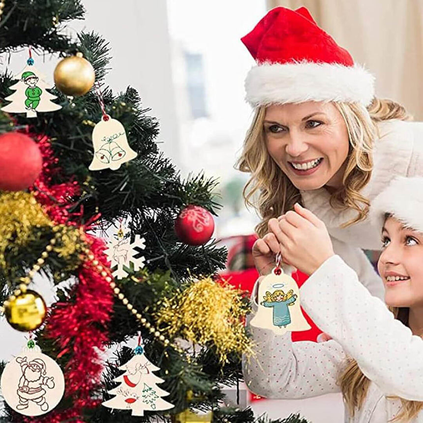 Woman and child decorating a Christmas tree with ornaments.