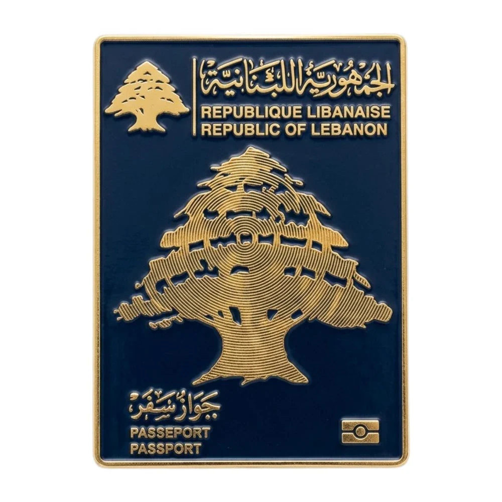 Lebanese passport cover with gold tree design on a blue background