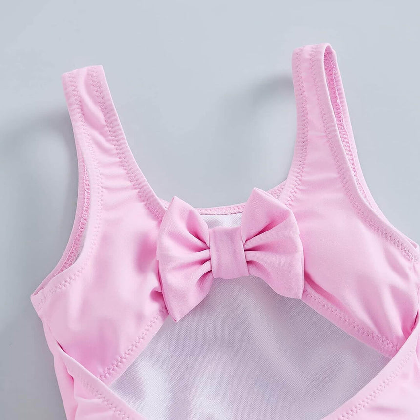 Pink seahorse bathing suit for girls with soft stretchy fabric, detailed shot