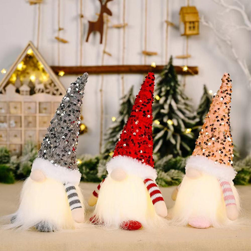 Christmas gnome made with glitter fabric and battery light