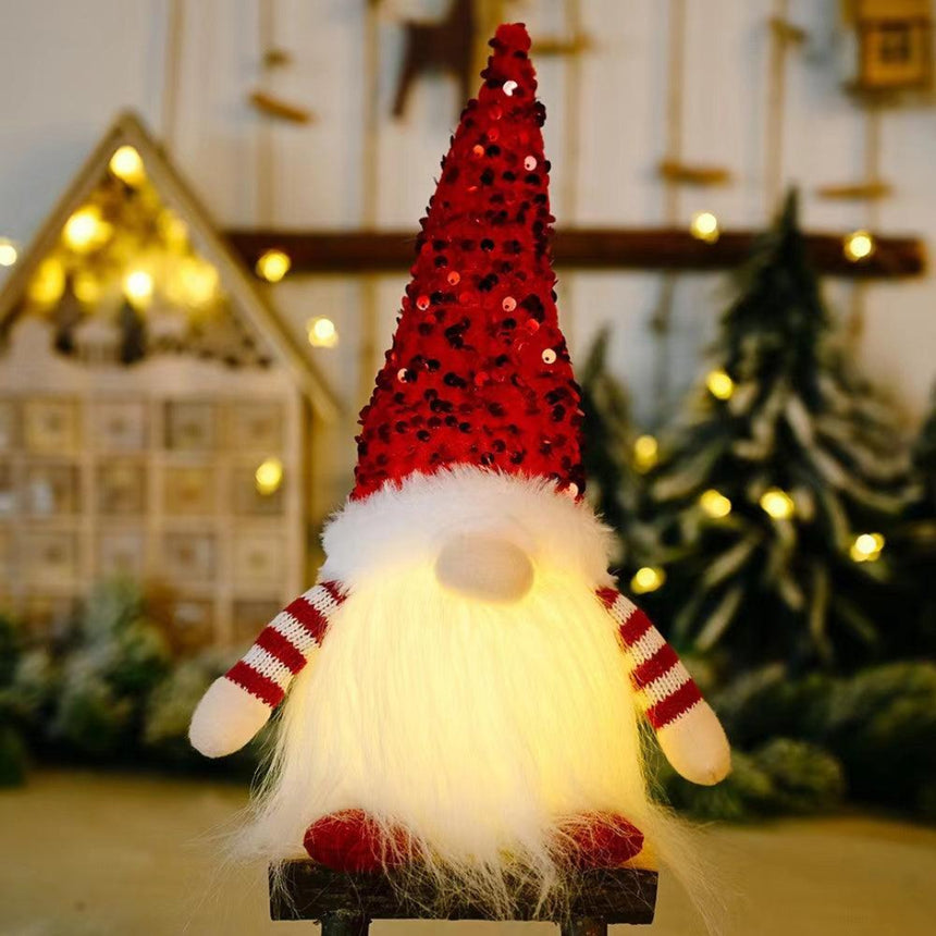 Sparkling red Christmas gnome with soft LED light