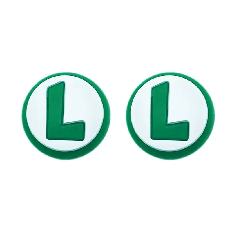 Two green and white circular earrings with a letter 'L' on a white background