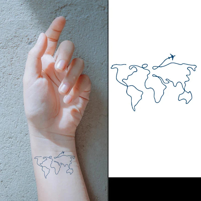 Hand with a temporary world map tattoo on a gray background, next to a world map design