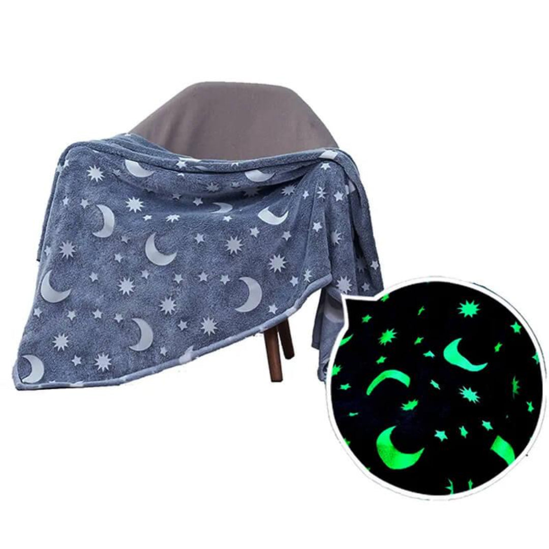 Glow-in-the-dark plush blanket with stars and moons, navy color.