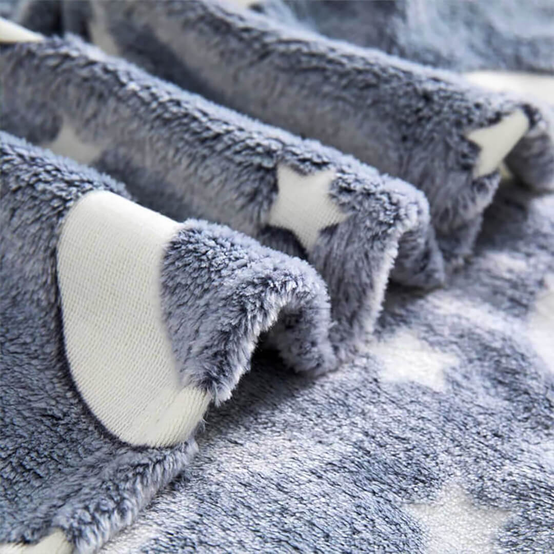 Cozy glow-in-the-dark blanket for bedtime.