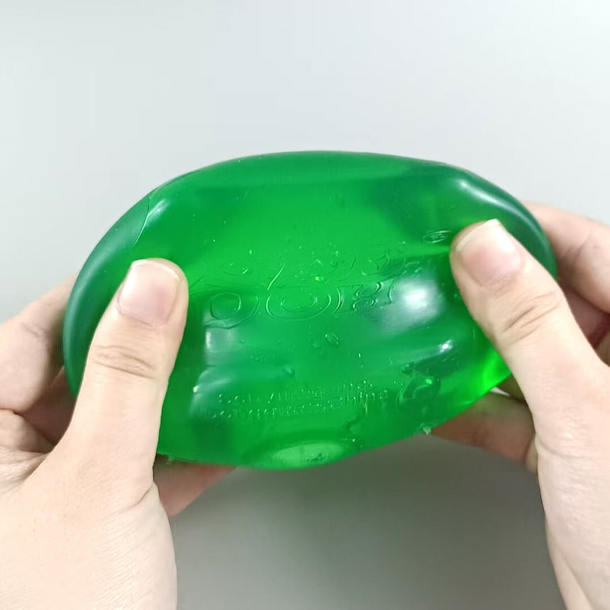 Green NeeDoh Nice Cube squeeze toy, soft and stretchy