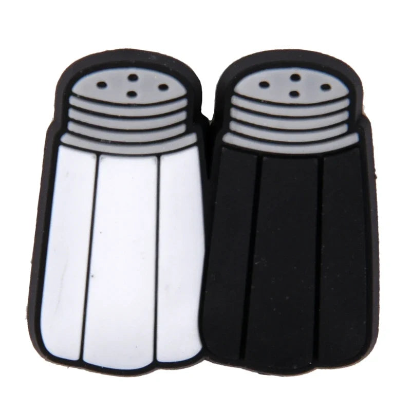 Black and white salt and pepper shakers on a white background