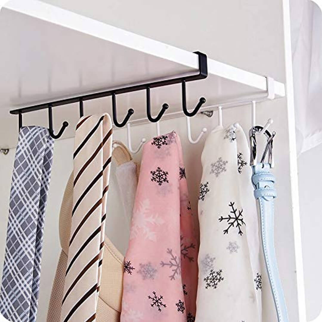 Clothing rack with multiple hooks holding various scarves and a belt.