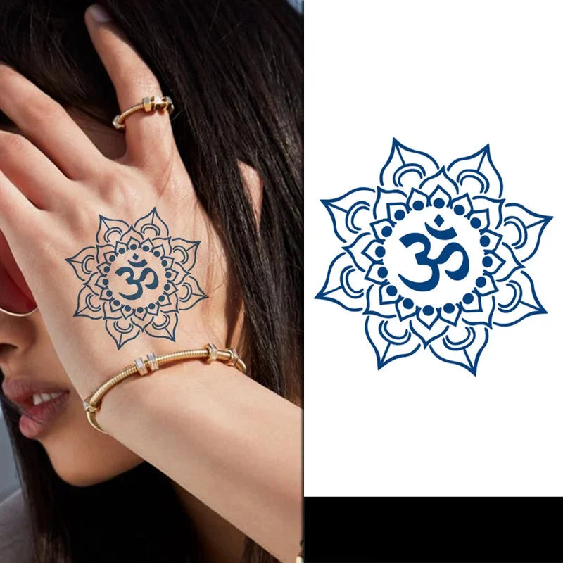 Mandala tattoo with Om symbol on a hand