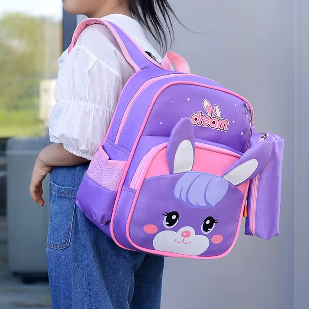 Girl wearing purple backpack with bunny design 