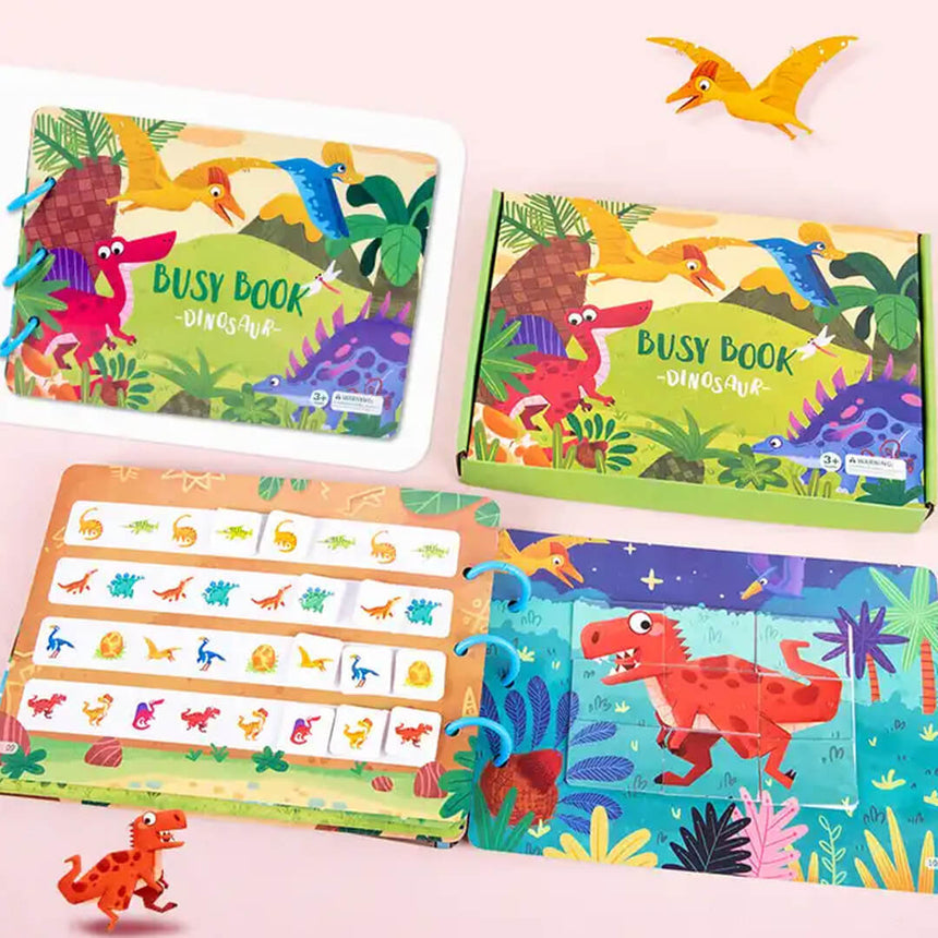 Kids learning with dinosaur-themed interactive busy book