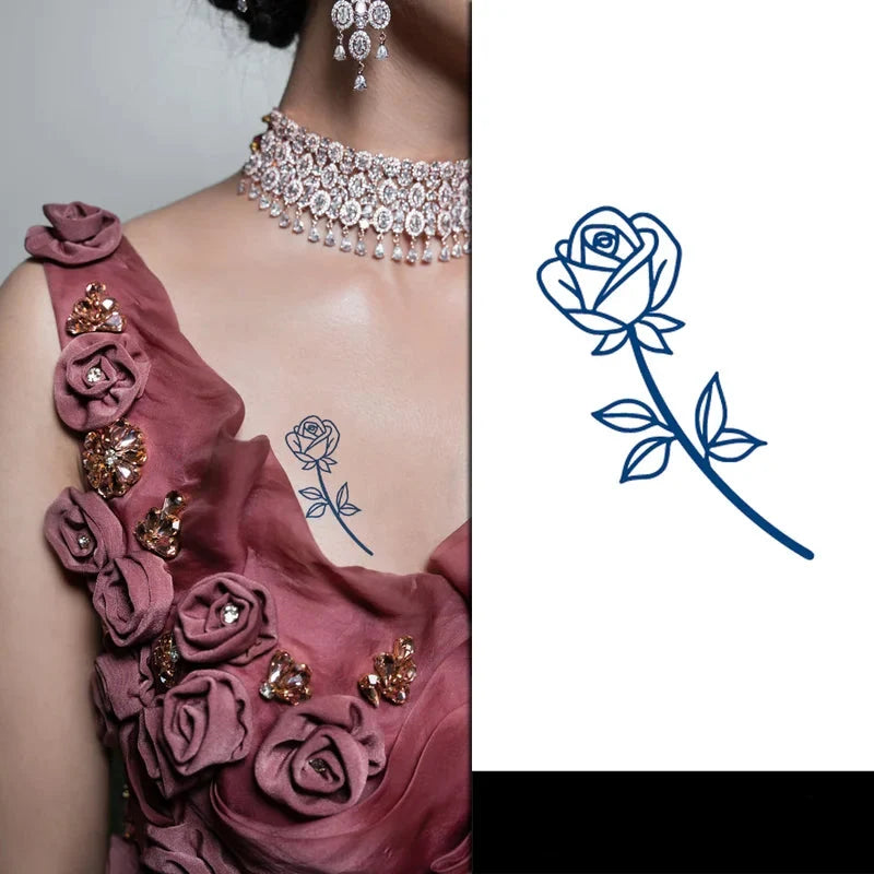 Woman wearing a pink floral dress with a rose tattoo and jewelry, including a necklace and earrings.