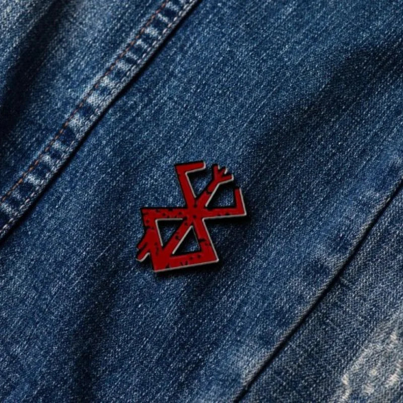 berserk brooch on denim jeans
