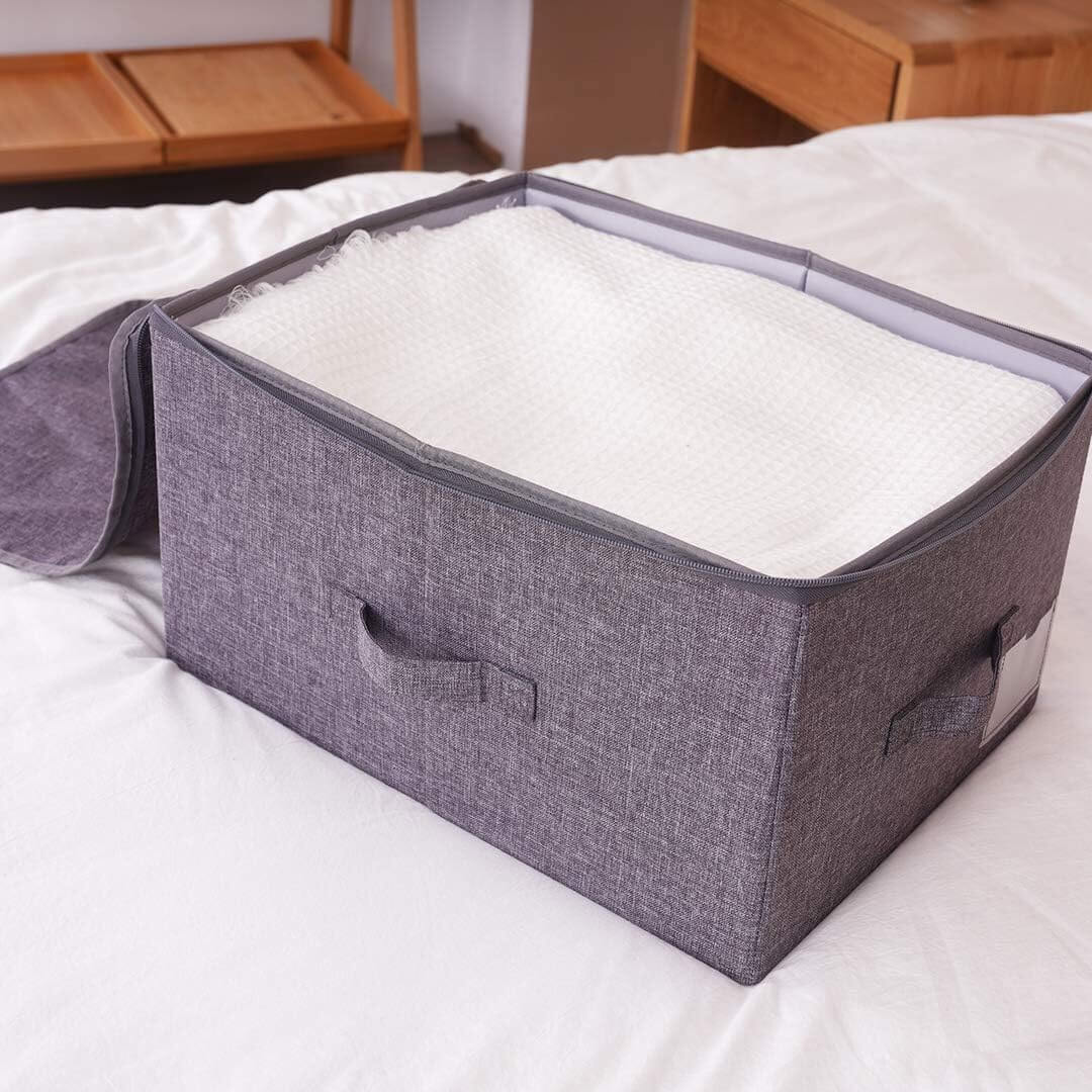 Foldable grey storage bin with zipper opening and reinforced sides