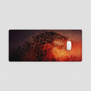 Phone case with a design of a snowman and tree on a red and black background