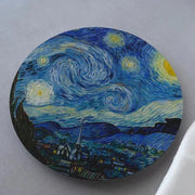 A round coaster with the famous Starry Night painting by Van Gogh, placed on a soft surface.