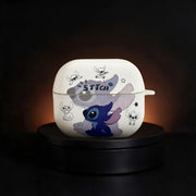 A white Galaxy Buds 3 and Buds 3 Pro case featuring a cartoon Stitch design, displayed on a black circular pedestal against a dark background.