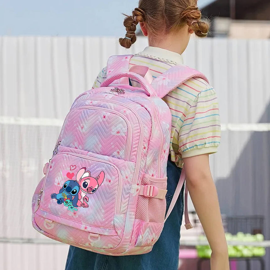 Pastel pink Stitch backpack featuring floral prints and heart zippers