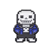 Pixel art enamel pin of Sans from Undertale, featuring a white pixelated skull and torso with blue hands and a black outline, on a solid white background.