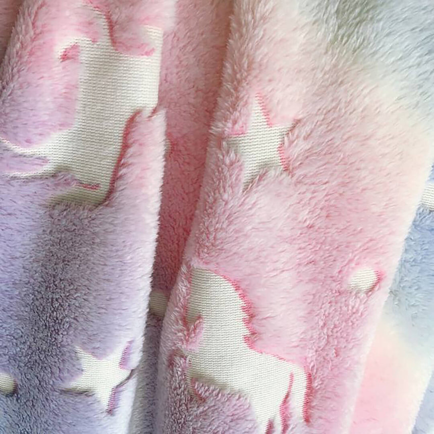 Rainbow glow unicorn fleece blanket forgirls, close-up shot.